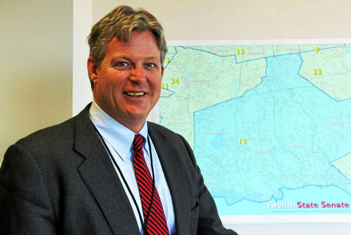 State Sen. Ted Kennedy Jr., D-12th, stands inside his office inside the Legislative Office Building next to a map of his district on Thursday, Jan. 8, in Hartford.