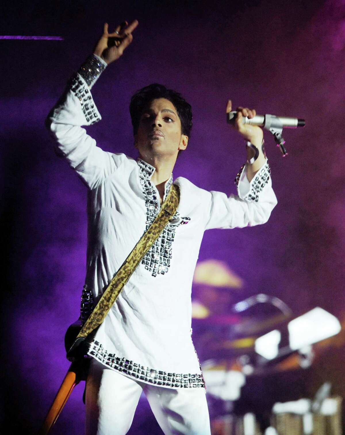 In this April 26, 2008, file photo, Prince performs during the second day of the Coachella Valley Music and Arts Festival in Indio, Calif. A law-enforcement official says that tests show the music superstar died of an opioid overdose. Prince was found dead at his home on April 21, 2016, in suburban Minneapolis. He was 57.