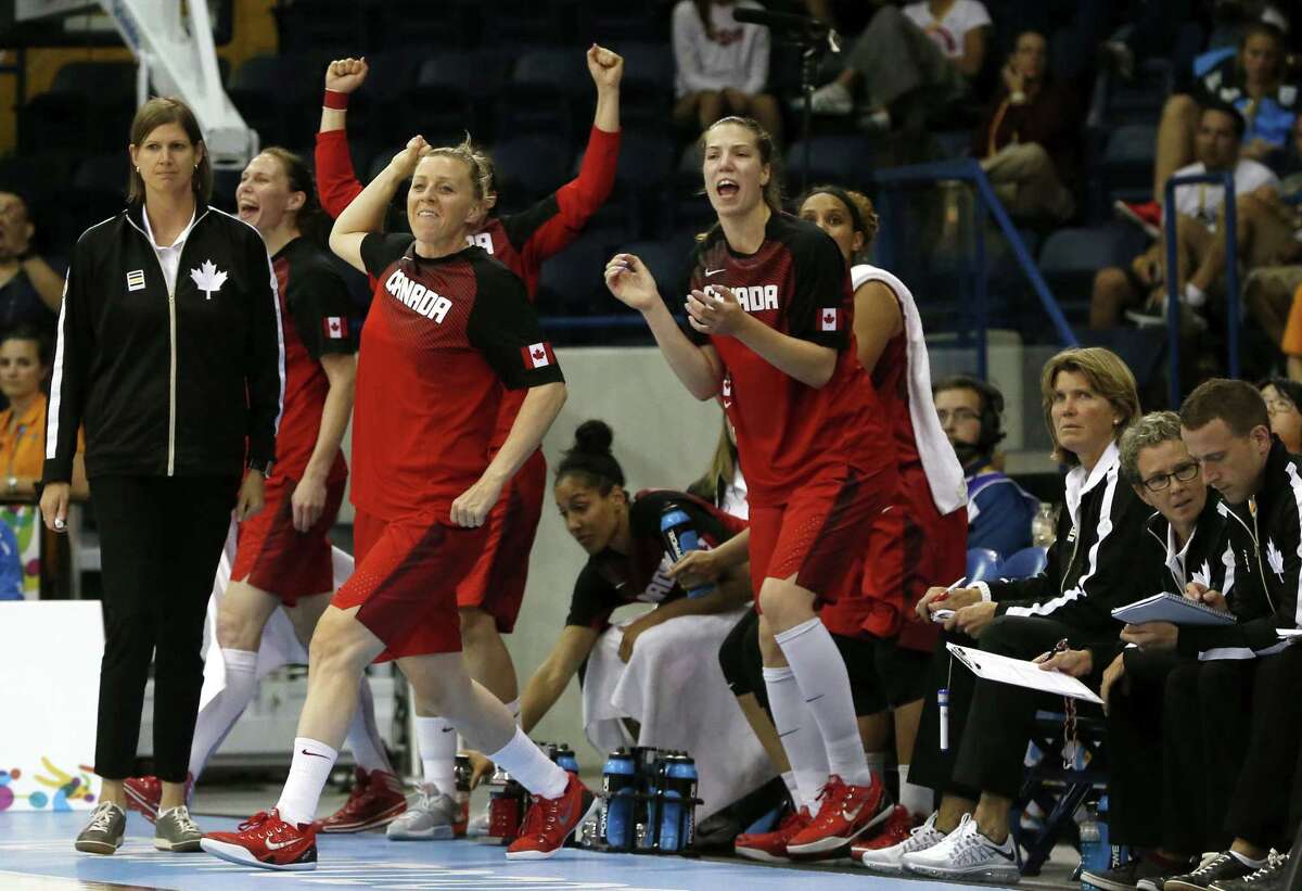 Team Canada reacts to a 3-pointer by Kia Nurse against the United States during the second quarter of the gold medal game at the Pan Am Games on Monday in Toronto.