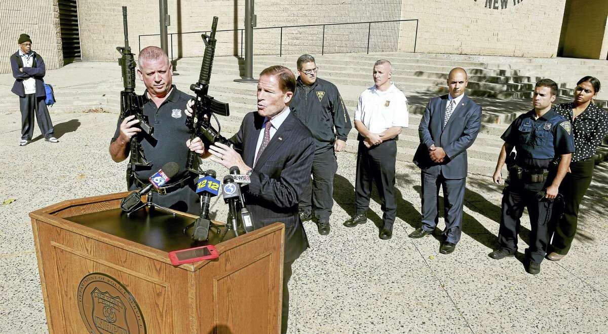 U.S. Sen. Richard Blumenthal, D-Conn., (center) held a press conference in front of the New Haven Police Department Monday to highlight the danger of paintball guns urging an update to federal law requiring clear markings on toy and facsimile guns to include paintball guns.