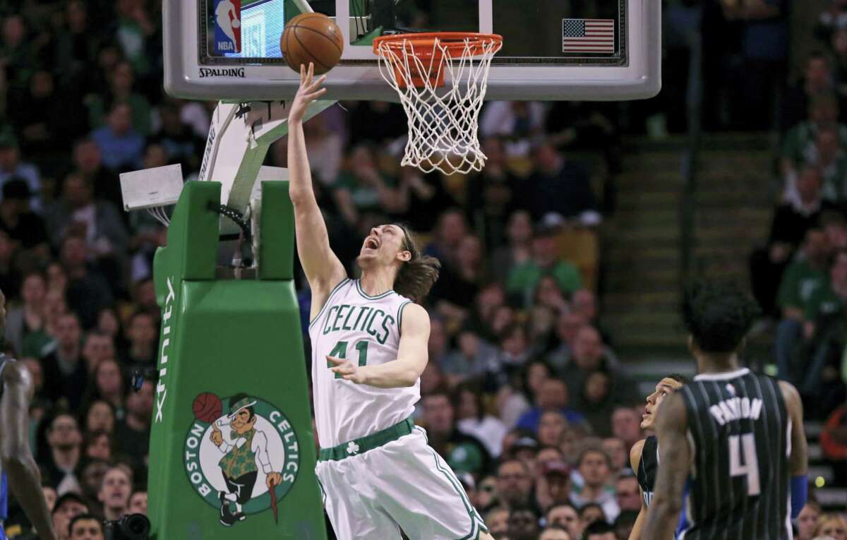 Boston Celtics center Kelly Olynyk (41) drops in a shot against the Orlando Magic during the second quarter Monday.