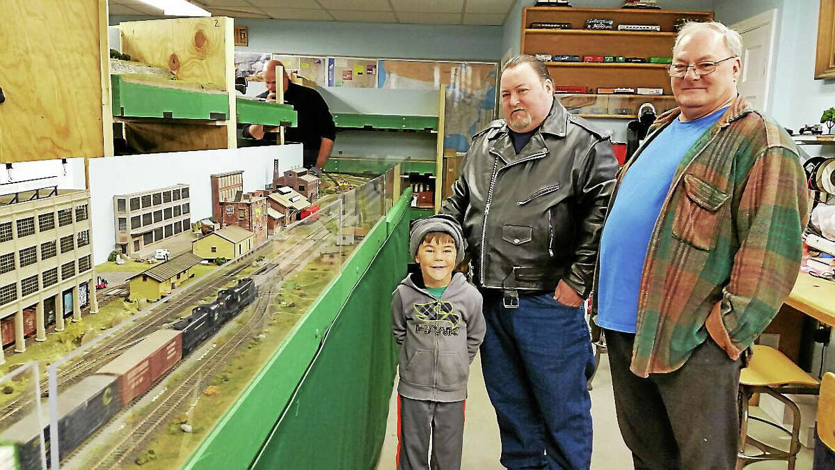 N.F. Ambery Richard Pellett, Edward Walsh, and Pellett’s grandson, Logan Marcano, 5, all of Torrington, enjoy the trains Sunday.