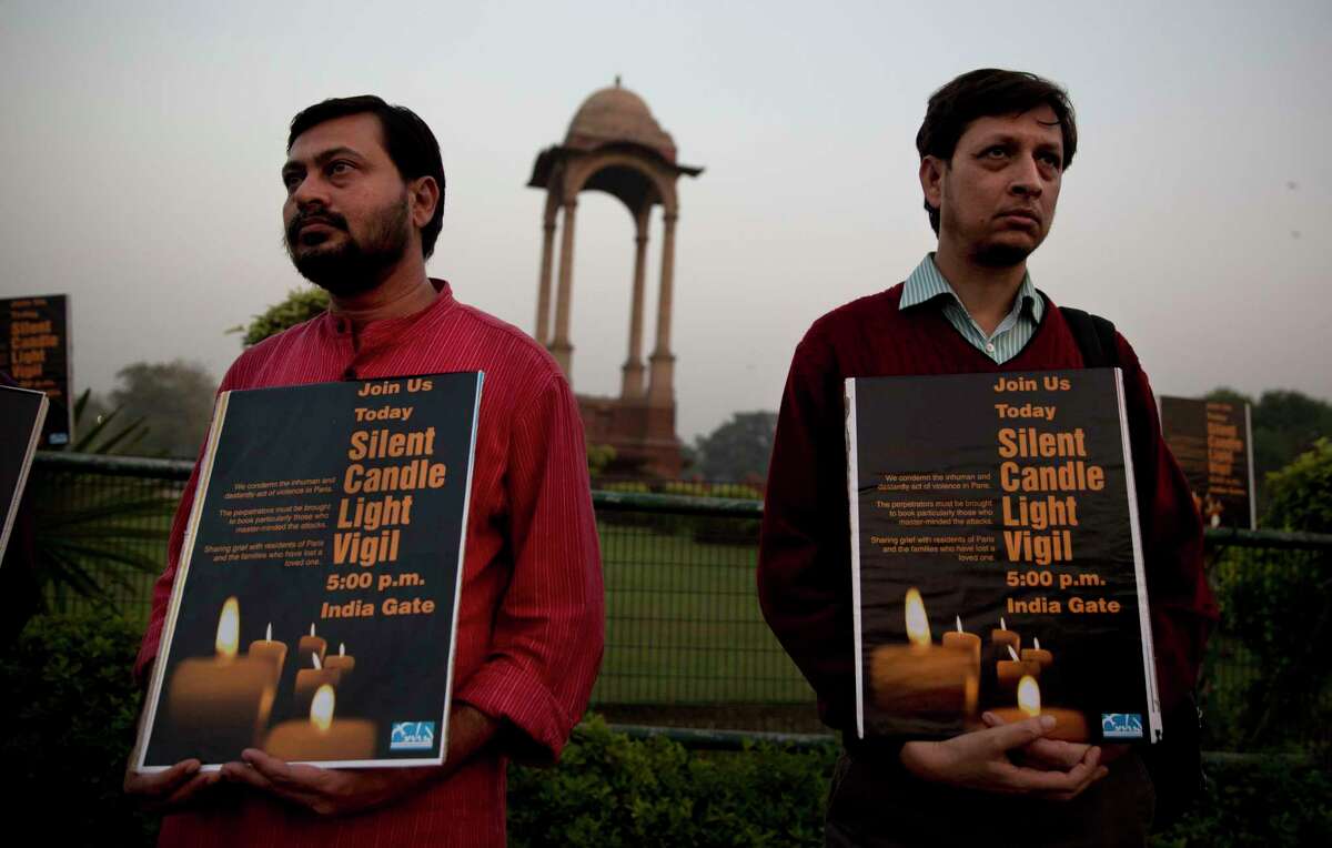 Indians participate in a vigil in remembrance of victims of Friday’s attacks in Paris, France, in New Delhi, India, Saturday, Nov. 14, 2015. Indian Prime Minister Narendra Modi, on a visit to the United Kingdom, said he condemned “the barbaric terrorist attacks in Paris in the strongest terms.”