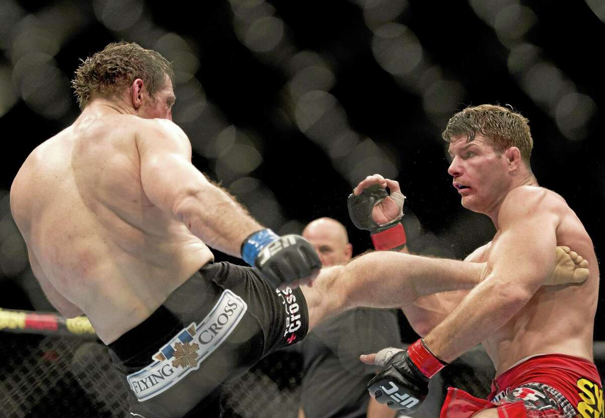 Michael Bisping, right, of England, and Tim Kennedy, of the United States, fight on April 16, 2014 at UFC Fight Night in Quebec City. Kennedy won.