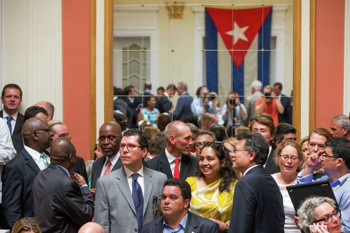 Visitors mingling in the newly reopened Cuban embassy in Washington on Monday, July 20, 2015. Cuba’s blue, red and white-starred flag was hoisted Monday at the country’s embassy in Washington in a symbolic move signaling the start of a new post-Cold War era in U.S.-Cuba relations.