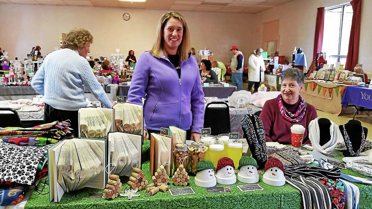 Julie Deile and Patrice Zubrowski of Torrington’s For the Home Creations sold book art and vanilla-scented beer-glass candles at the Litchfield Firehouse at 258 West St. Saturday.