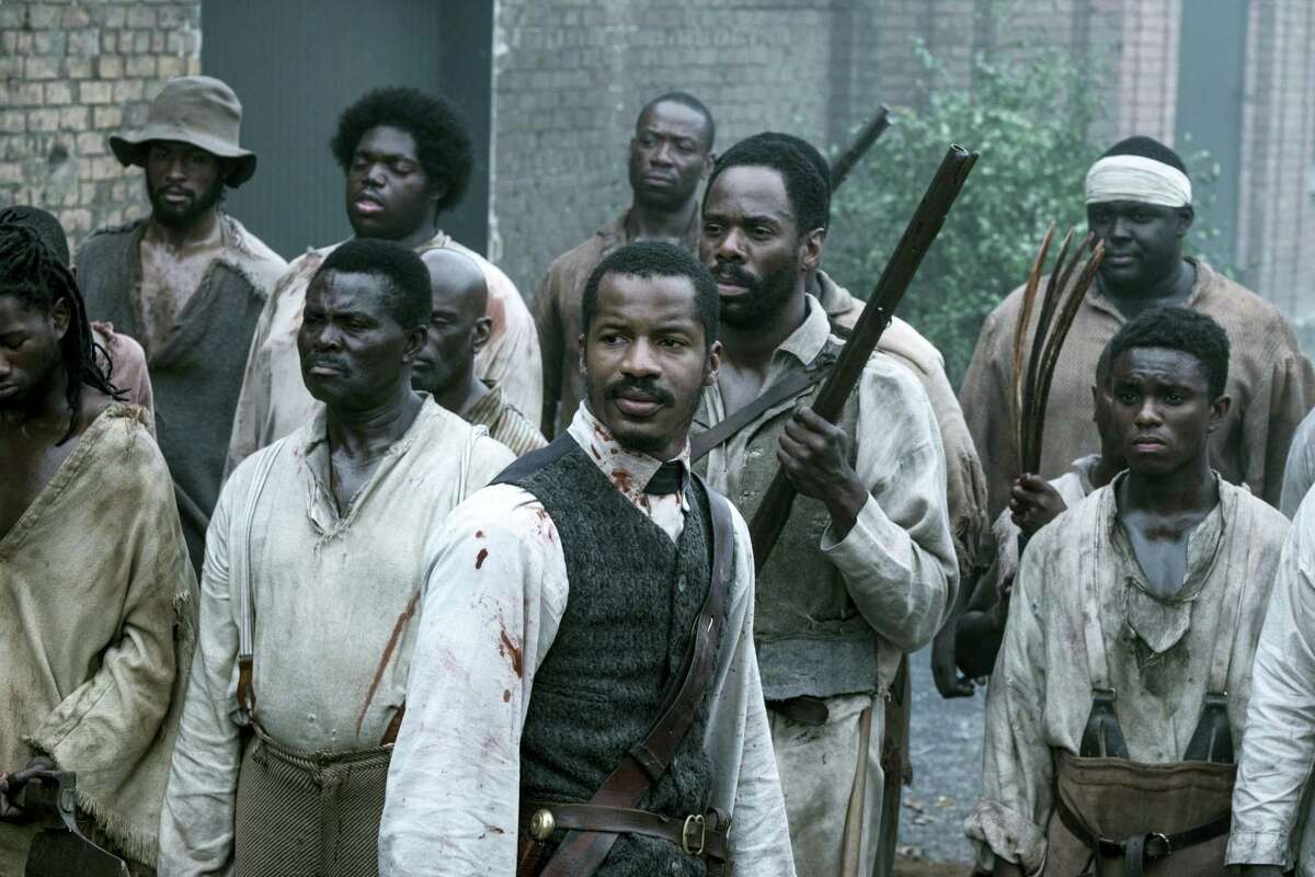 In this file image released by Fox Searchlight Films shows Nate Parker as Nat Turner, center, in a scene from “The Birth of a Nation.” Nate Parker’s Nat Turner biopic “The Birth of a Nation,” opened with a disappointing $7.1 million, according to studio estimates on Oct. 9, 2016.