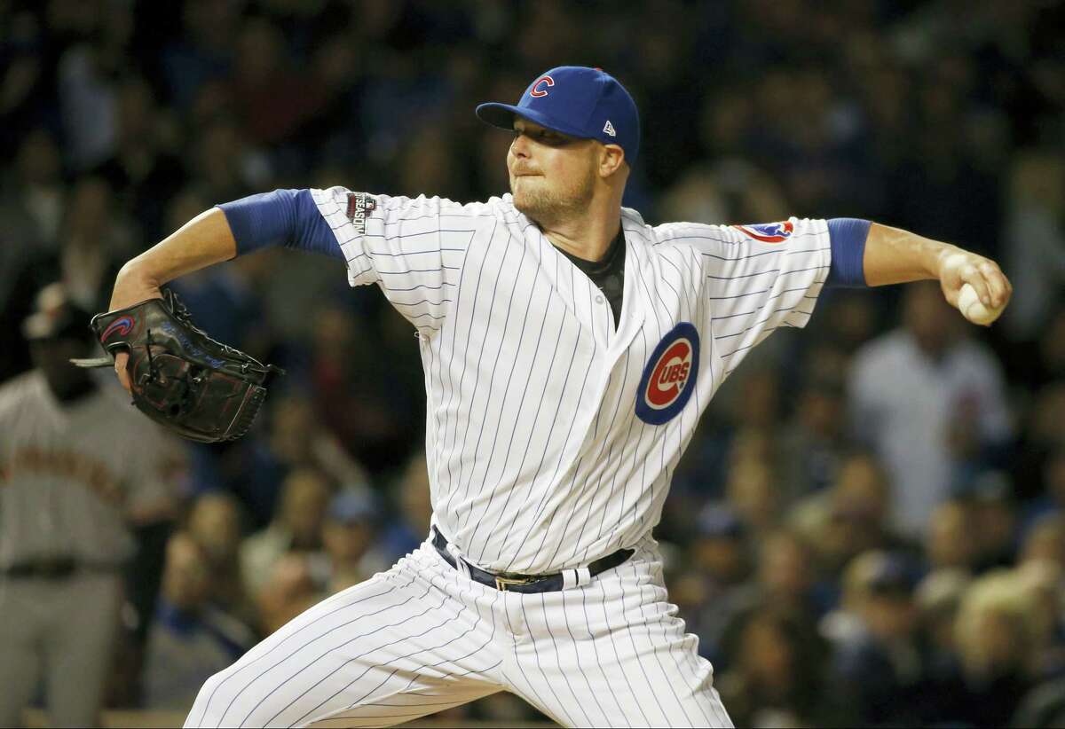 Cubs starting pitcher Jon Lester (34) throws in the first inning on Friday.