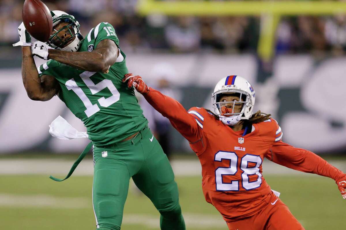 New York Jets receiver Brandon Marshall is unable to make a catch as Buffalo Bills cornerback Ronald Darby (28) defends during Thursday’s game in East Rutherford, N.J.