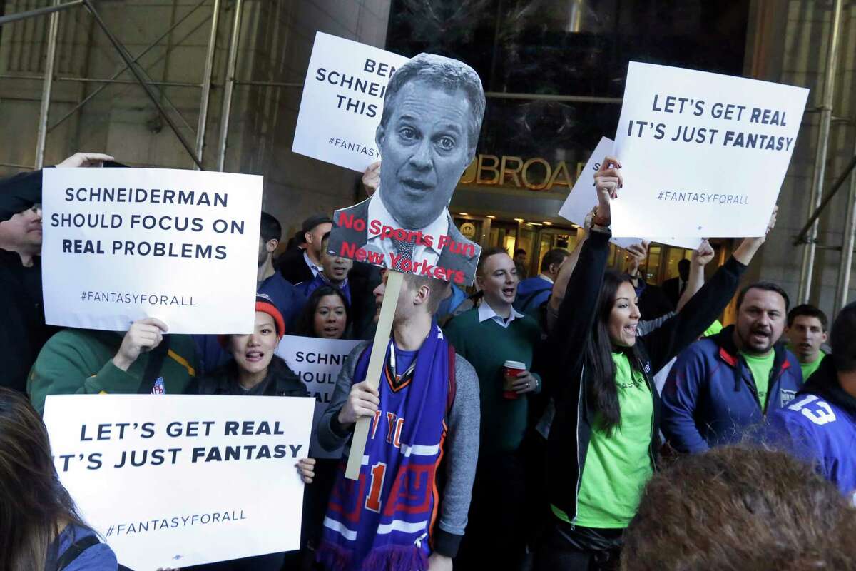Fantasy sports fans demonstrate outside the Financial District offices of New York state Attorney General Eric Schneiderman on Friday in New York.