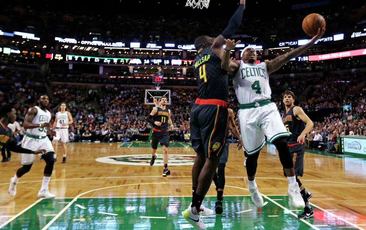 Celtics guard Isaiah Thomas (4) drives to the basket against Atlanta Hawks forward Paul Millsap (4) during Friday’s game in Boston.