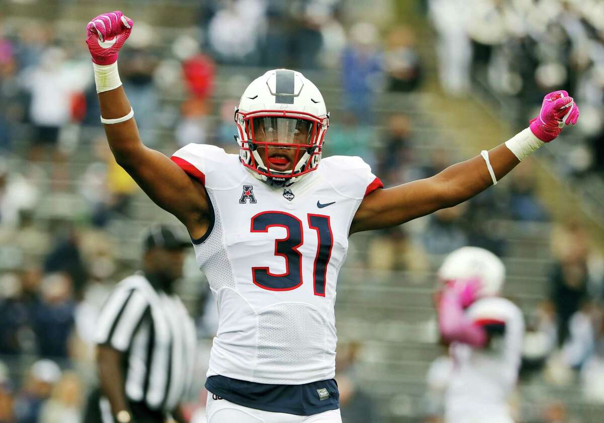 UConn cornerback John Robinson IV celebrates during the final seconds of the Huskies’ win on Saturday.