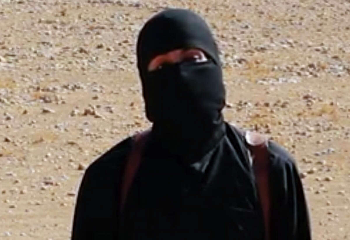 This still image from undated video released by Islamic State militants on Oct. 3, 2014, purports to show the militant known as Jihadi John. A U.S. drone strike targeted a vehicle in Syria believed to be transporting the masked Islamic State militant known as “Jihadi John” on Thursday, Nov. 12, 2015, according to American officials. Whether the strike killed the British man who appears in several videos depicting the beheadings of Western hostages was not known, officials said.