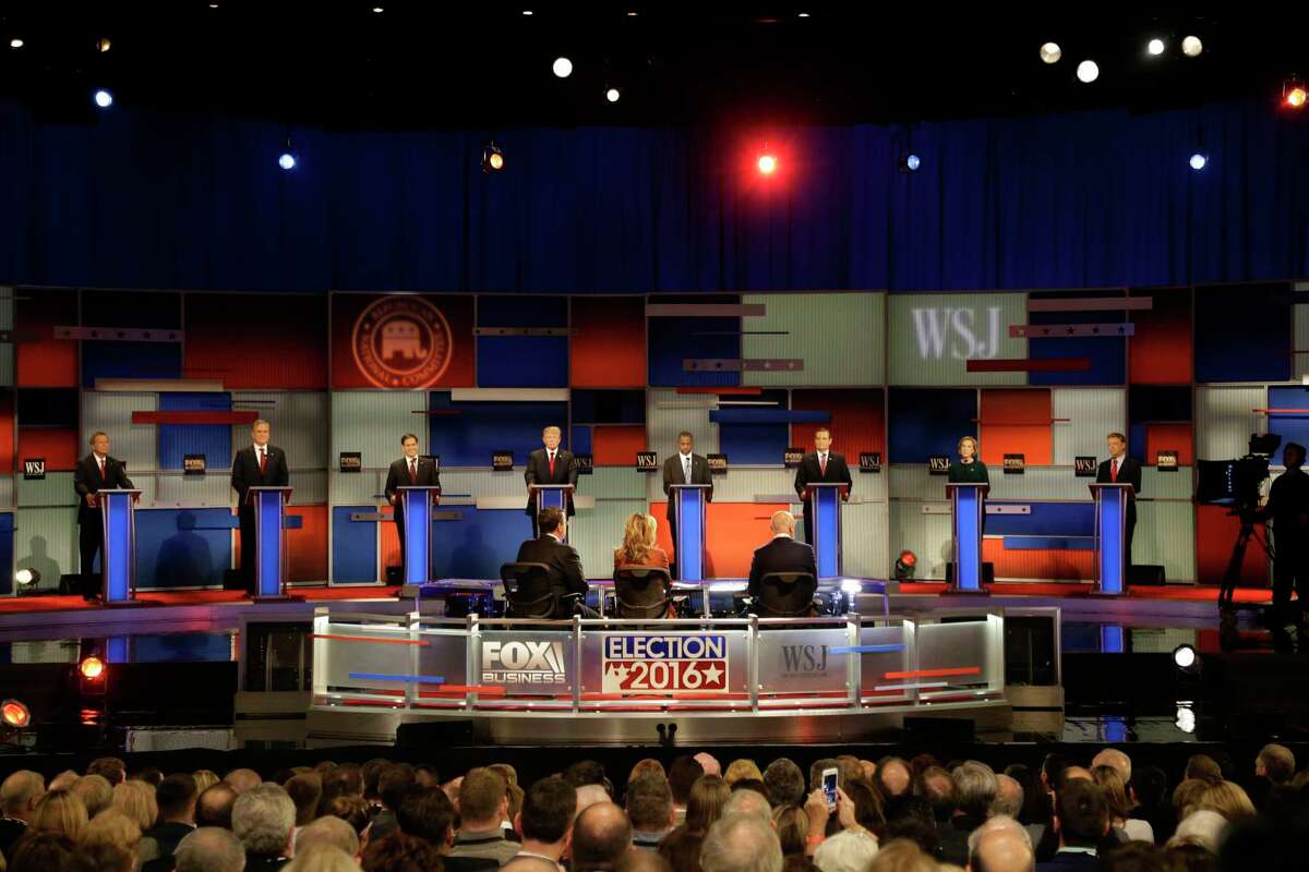 Republican presidential candidates John Kasich, Jeb Bush, Marco Rubio, Donald Trump, Ben Carson, Ted Cruz, Carly Fiorina and Rand Paul appear during the Republican presidential debate at the Milwaukee Theatre, Tuesday, Nov. 10, 2015, in Milwaukee. (AP Photo/Jeffrey Phelps)