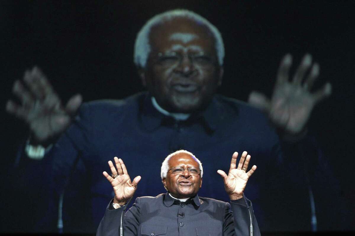 South African Archbishop Desmond Tutu addresses youths at the One Young World,World Summit at Old Billingsgate in London in 2010.