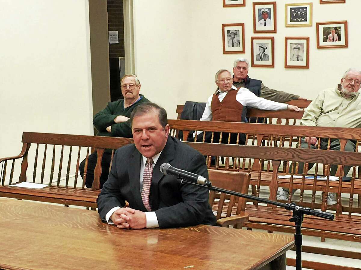 William Fitzgerald speaks to local officials in Winsted prior to his joining the local police department earlier this year.