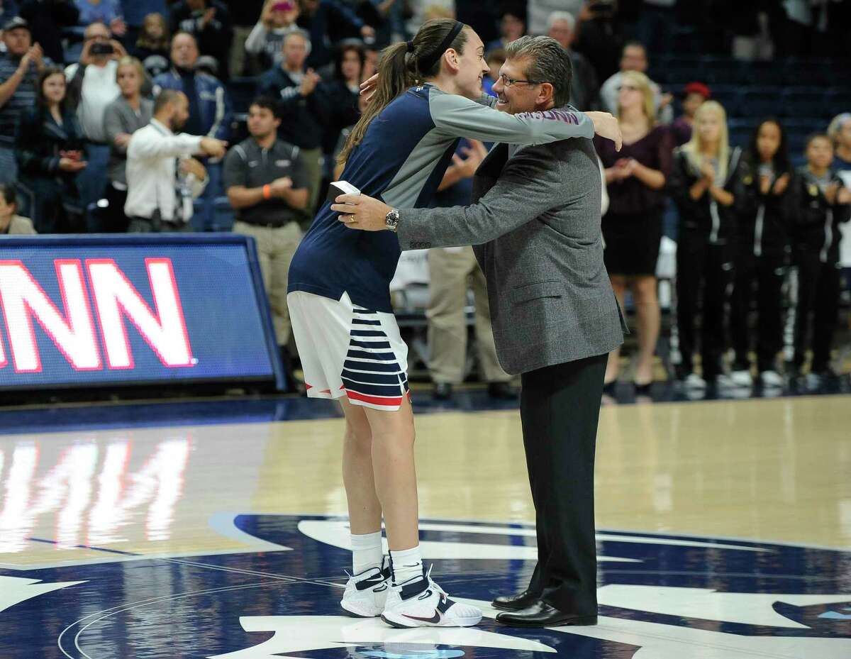 UConn coach Geno Auriemma hugs senior Breanna Stewart during a ceremony in which the Huskies received rings for their 2015 national championship prior to an exhibition game against Vanguard on Sunday in Storrs.