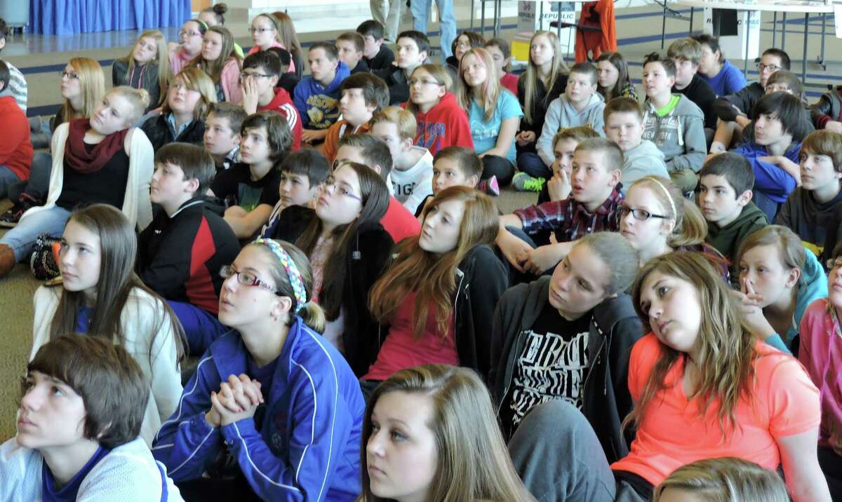 Middle school students sit as they watch the launch of four devices into space Friday, March 13, 2015, at the Robert H. Mollohan Research Center, in Fairmont, W.V. (AP Photo/Times West Virginian, Richard Babich)