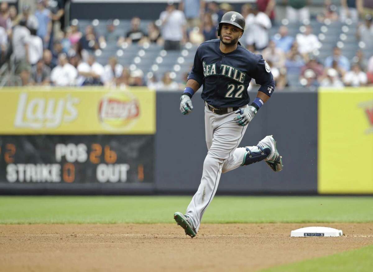 The Seattle Mariners’ Robinson Cano rounds the bases after hitting a two-run home run in the first inning of Saturday’s game against the Yankees on Saturday in New York.