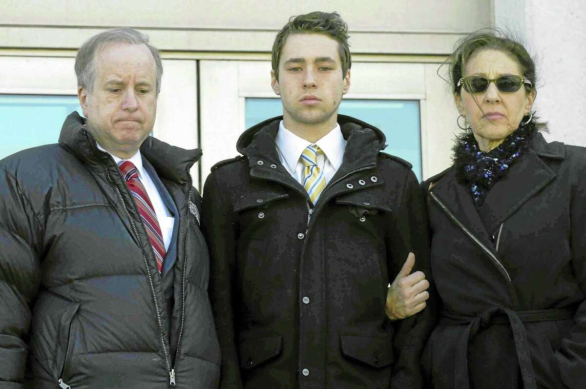 In this Feb. 25 file photo, former Wesleyan University sophomore Zachary Kramer, 21, of Bethesda, Md., leaves Middletown Superior Court with his parents after his arraignment for possession of controlled substances and other charges. He is one of five students arrested after a rash of illnesses on campus linked to the party drug Molly.