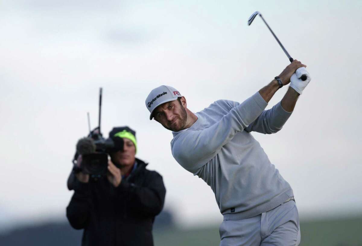 Dustin Johnson tees off from the 7th hole during the second round of the British Open on Friday.