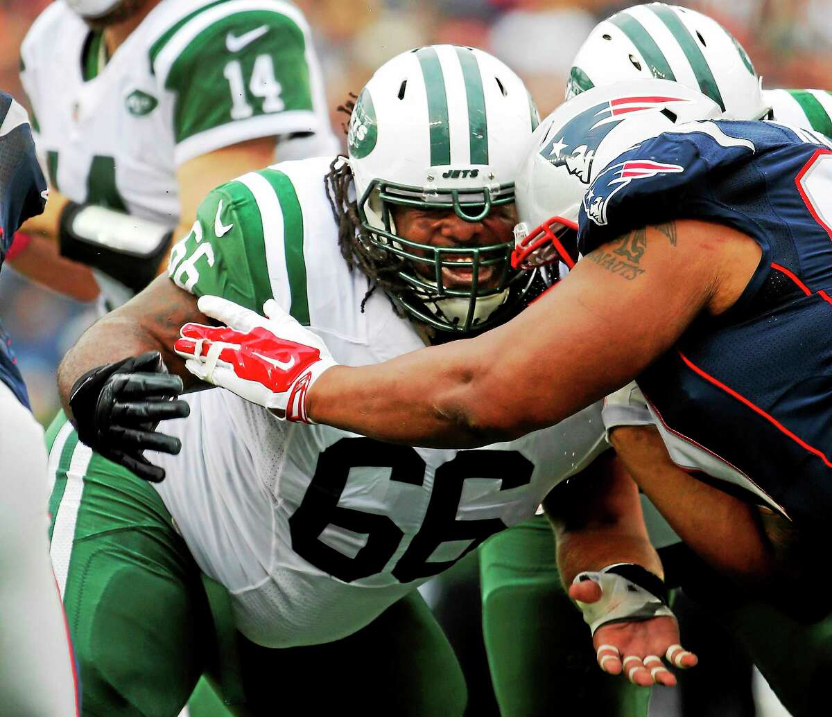 New York Jets guard Willie Colon blocks against the New England Patriots during an Oct. 25 game at Gillette Stadium in Foxborough, Mass.