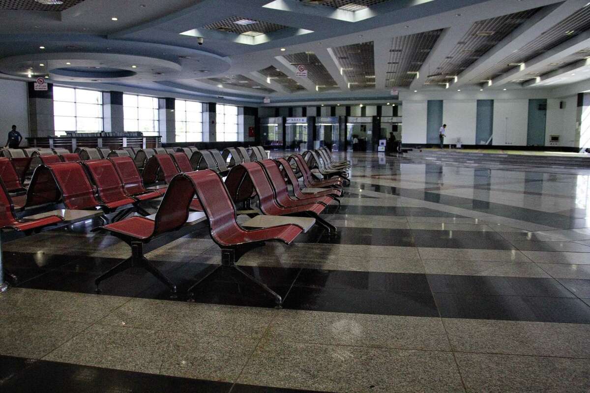 In this Monday, Nov. 9, 2015, file photo, the arrival hall is empty at the Sharm el-Sheikh Airport in south Sinai, Egypt. Egypt’s benchmark stock index plunged 4.4 percent on Tuesday, Nov. 10, 2015, after steadily declining since Russia suspended flights to Egypt following the Oct. 31 Russian plane crash in the Sinai Peninsula. Russia suspended all flights to Egypt ast Friday amid airport security concerns — a move that threatened to further devastate the Egyptian tourism industry, already suffering after years of political turmoil.