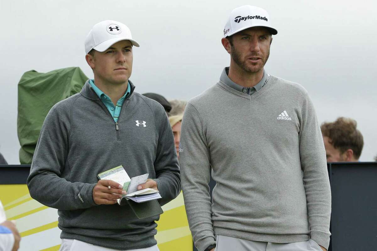 Jordan Spieth, left, and Dustin Johnson speak before hitting from the 15th tee during the first round of the British Open on Thursday at the Old Course, St. Andrews, Scotland.