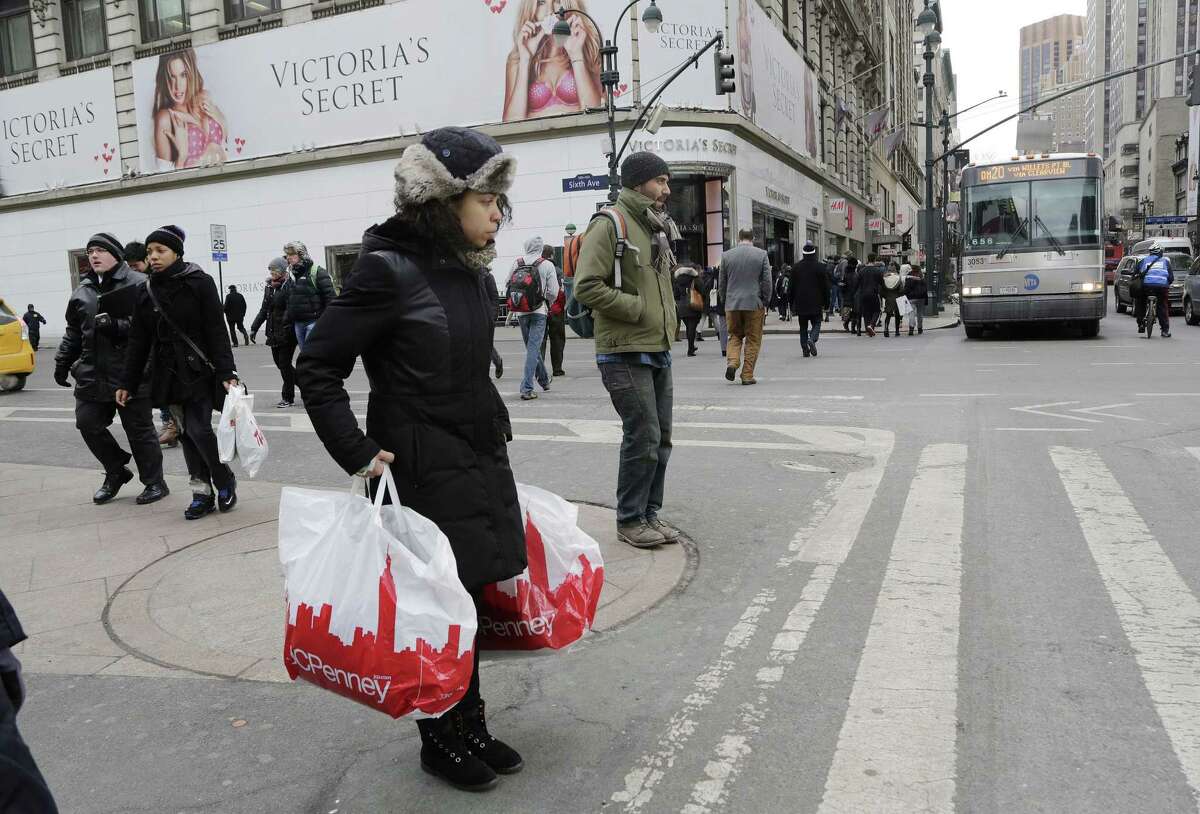 A shopper carries JCPenney shopping bags in New York.