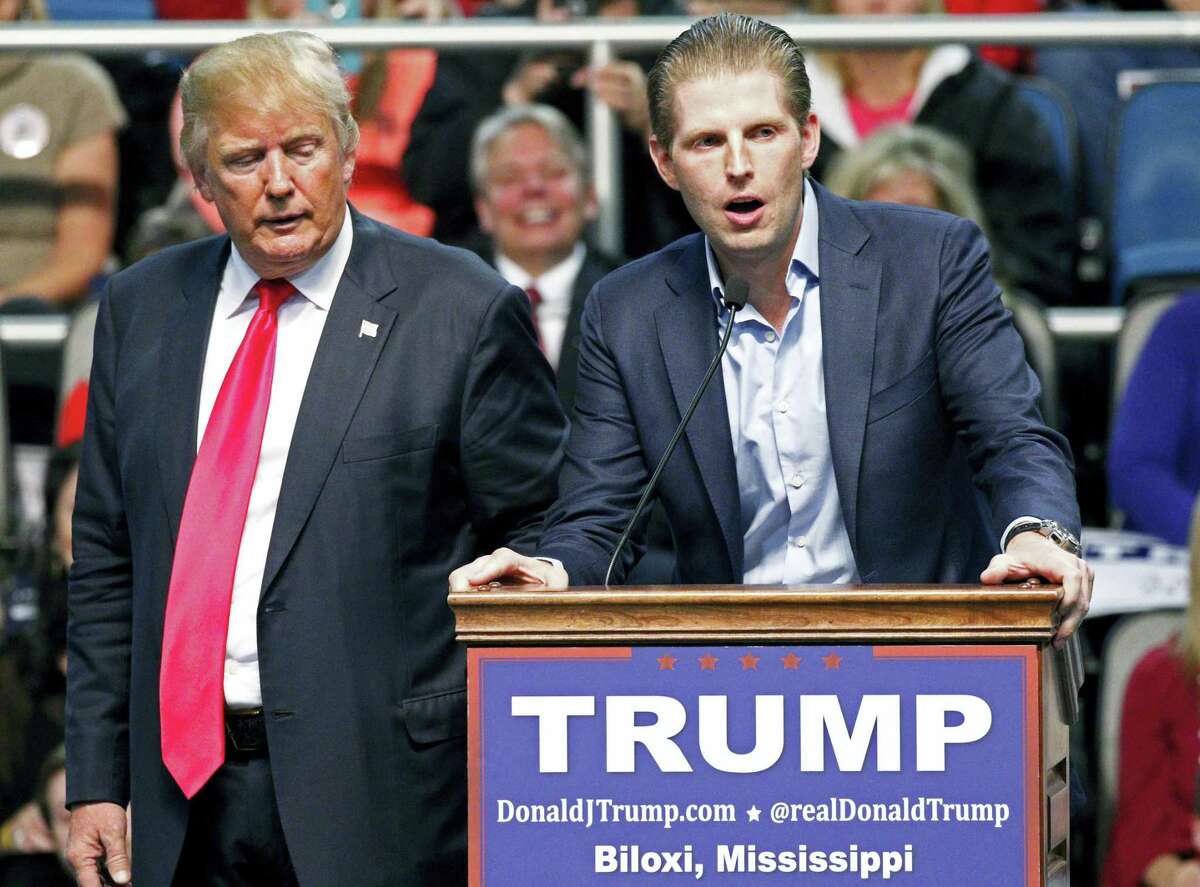 In this Jan. 2, 2016 file photo, Republican presidential candidate Donald Trump, left, listens as his son Eric Trump speaks during a rally in Biloxi, Miss. A law enforcement official says New York City police and the FBI are investigating a threatening letter sent to the Manhattan apartment of Eric Trump. The official says the envelope sent to Eric Trump’s apartment on Thursday, March 17, 2016, contained a suspicious white powder and a threatening letter. There were no injuries and the official said preliminary tests indicated that the white substance was not hazardous.