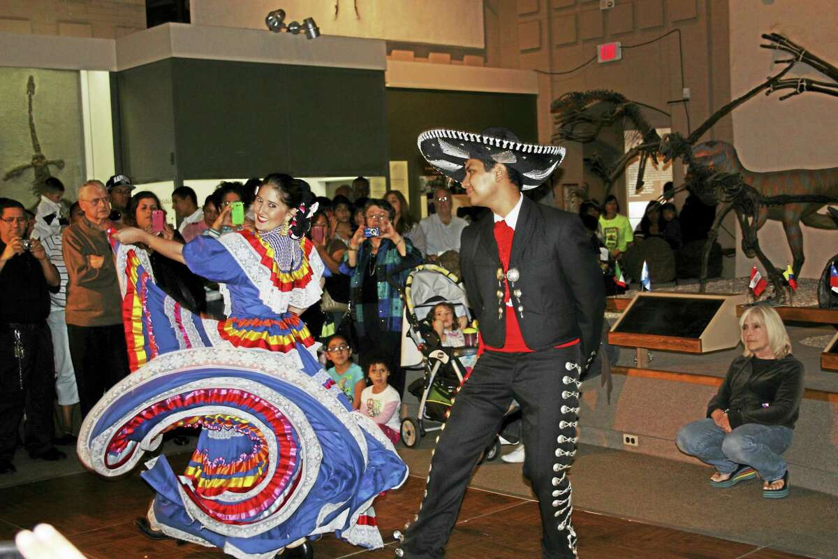 A Fiesta Latina crowd enjoys traditional music and dance.
