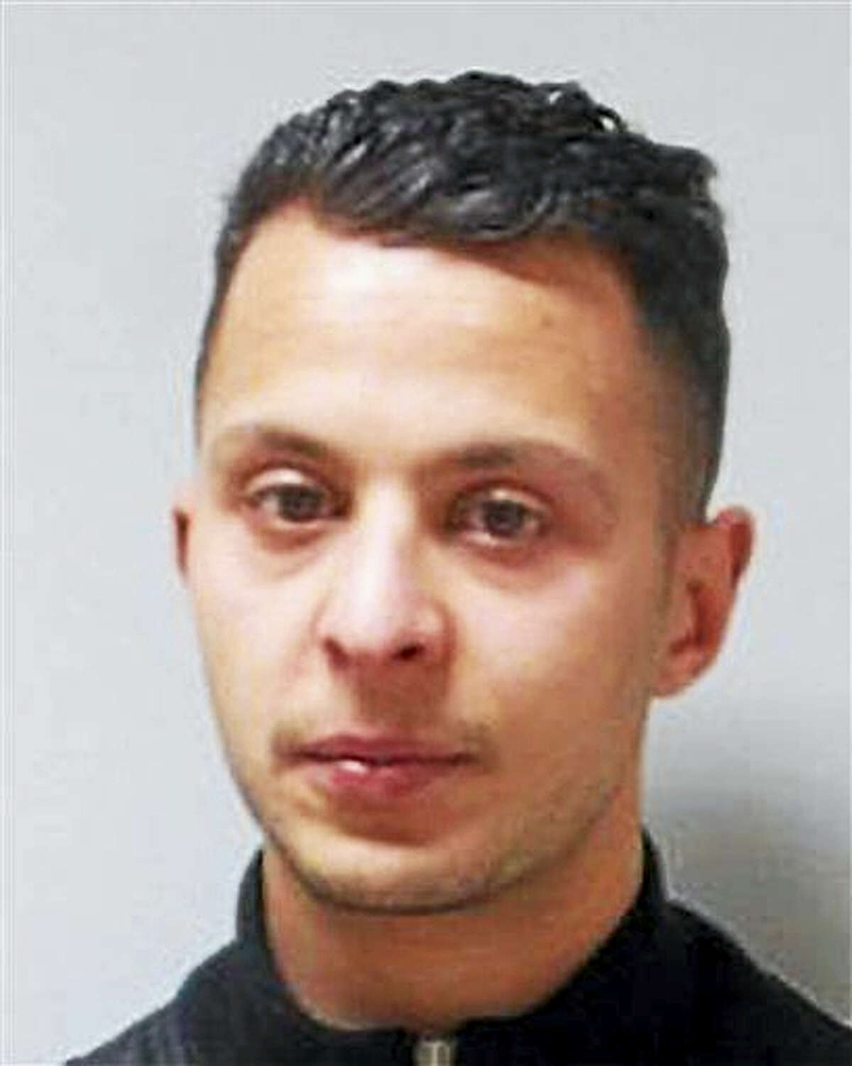 This undated file photo provided by the Belgian Federal Police shows 26-year old Salah Abdeslam, who is wanted by police in connection with recent terror attacks in Paris. Belgian prosecutors said Friday March 18, 2016, that fingerprints of Paris attacks fugitive Salah Abdeslam found in Brussels apartment that was raided earlier this week.
