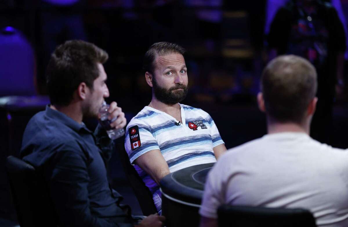 Daniel Negreanu, center, competes at the World Series of Poker main event on Tuesday in Las Vegas.