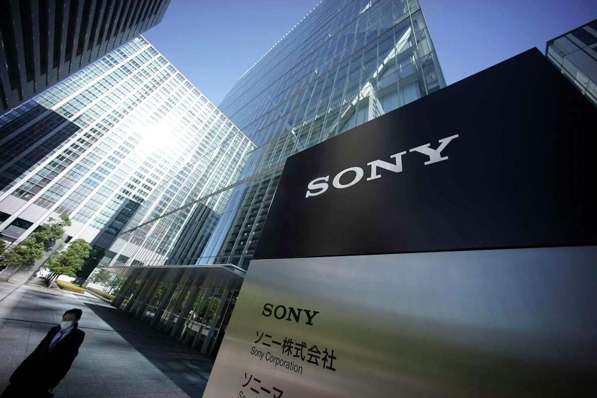 In this Dec. 18, 2014, file photo, a man walks out from the headquarters of Sony Corp. in Tokyo. Improving cybersecurity practices has emerged as a top national priority for Japan, stung in recent years by embarrassing leaks at Sony Pictures, the national pension fund and its biggest defense contractor, Mitsubishi Heavy Industries.