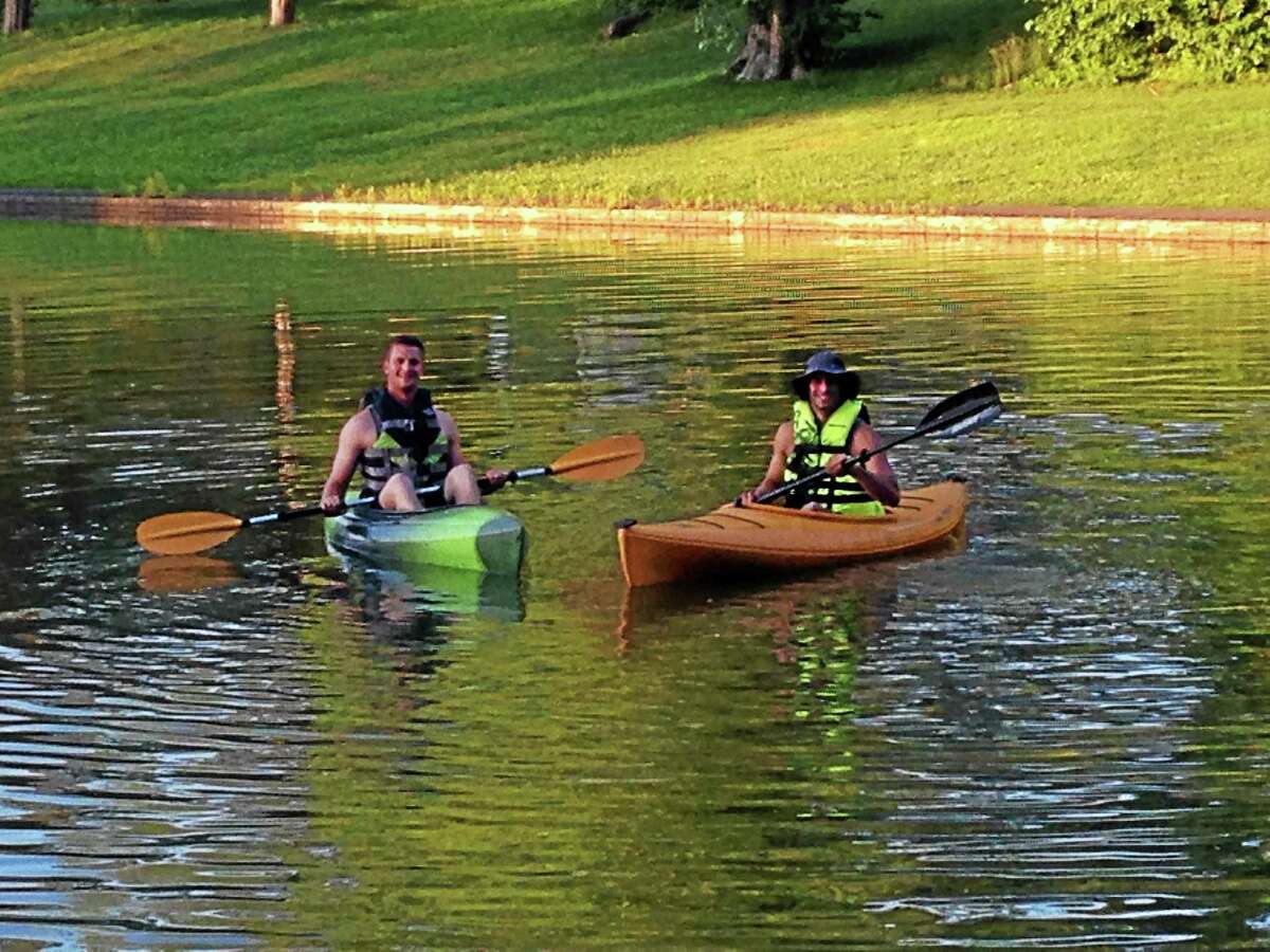 Brian McManus, left, and Andrew Jimenez practice kayaking to get ready for their 10-day trip down the Housatonic River from Pittsfield, Mass., to Stratford, Conn.