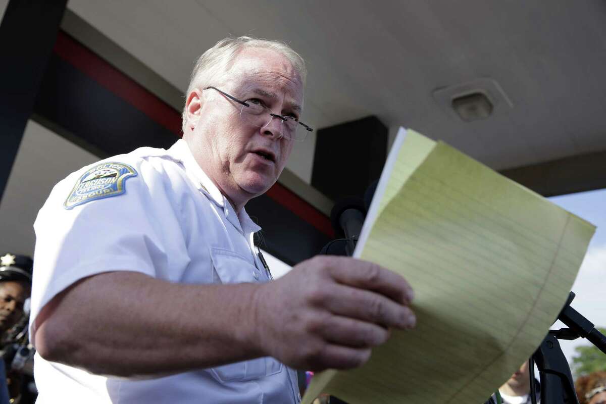 FILE - In this Aug. 15, 2014 file photo, Ferguson Police Chief Thomas Jackson releases the name of the the officer accused of fatally shooting Michael Brown in Ferguson, Mo. On Friday, March 6, 2015, Jackson is still on the job, two days after a government report criticized his department for years of racial profiling.