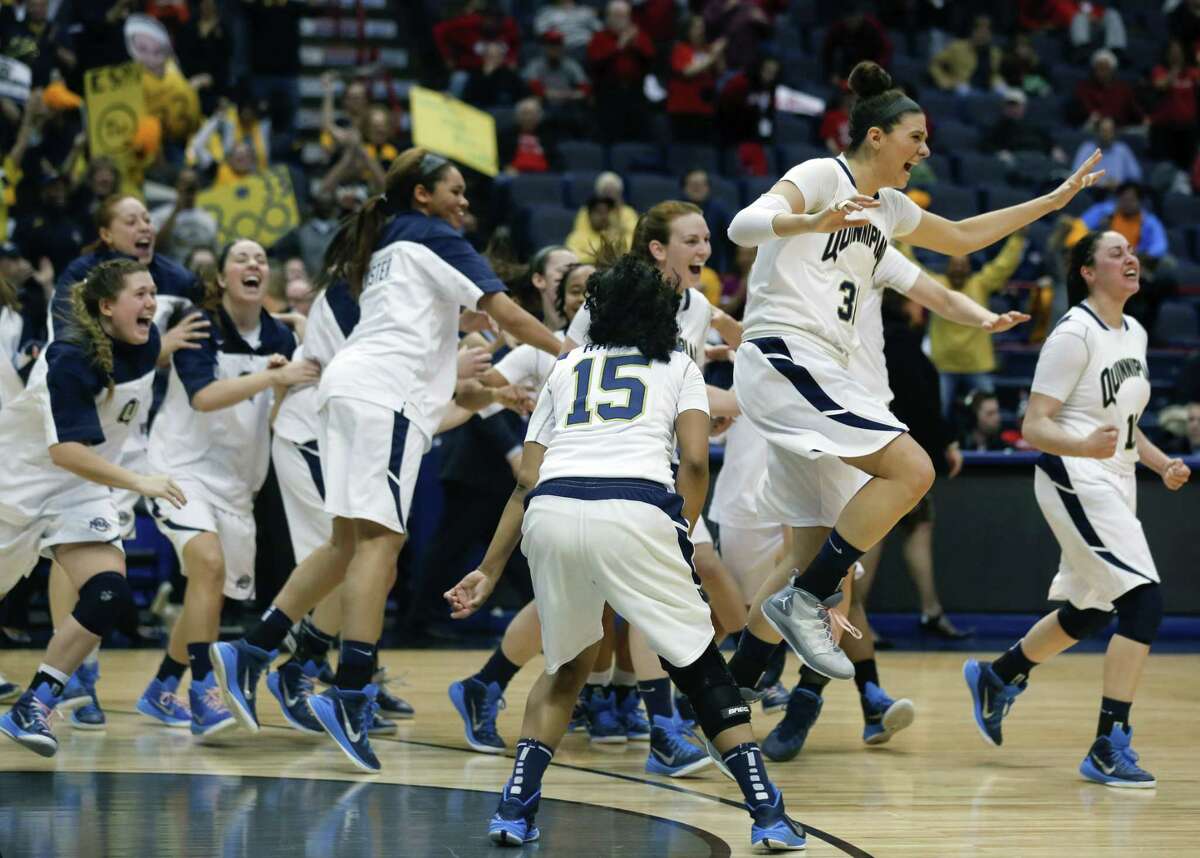 Quinnipiac players celebrate their 72-61 win over Marist in the MAAC tournament championship game Monday in Albany, N.Y.