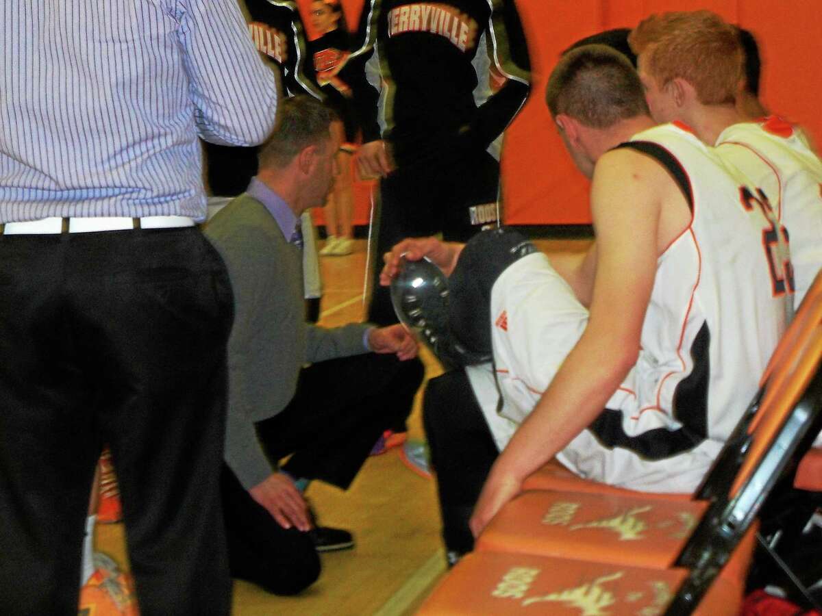 Terryville coach Mark Fowler talks strategy for the Kangaroos’ 58-37 win over Portland Tuesday night in a first-round Class S game at Terryville High School.