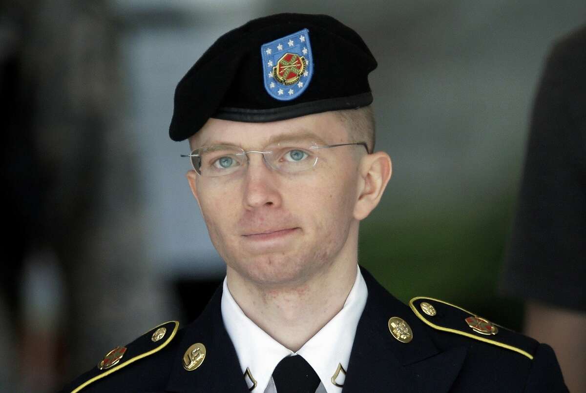 FILE - In this June 5, 2013, file photo Army Pvt. Chelsea Manning, then-Army Pfc. Bradley Manning, is escorted out of a courthouse in Fort Meade, Md., after the third day of his court martial. The Associated Press has learned that Pentagon leaders are finalizing plans aimed at lifting the ban on transgender individuals serving in the military. Senior U.S. officials say an announcement is expected this week. They say the military would have six months to determine the impact and work out details, with the presumption that they would end one of the last gender- or sexuality-based barriers to military service. (AP Photo/Patrick Semansky, File)