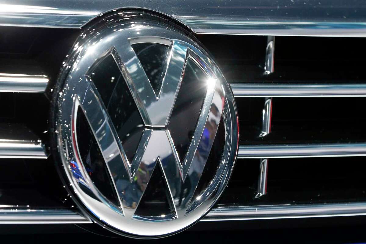 In this Sept. 22, 2015 photo, the Volkswagen logo of a car is photographed during a car show in Frankfurt, Germany.