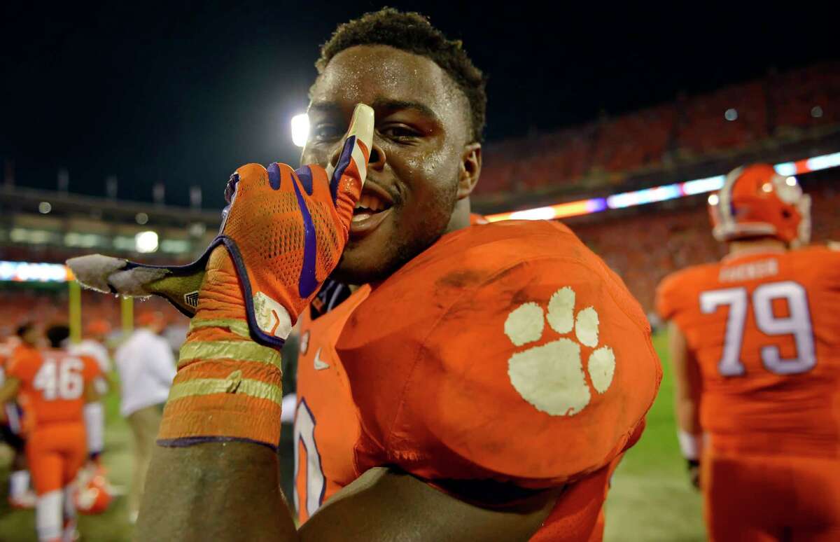 Clemson’s Shaq Lawson celebrates in the closing minutes of their 23-13 win over Florida State on Saturday.