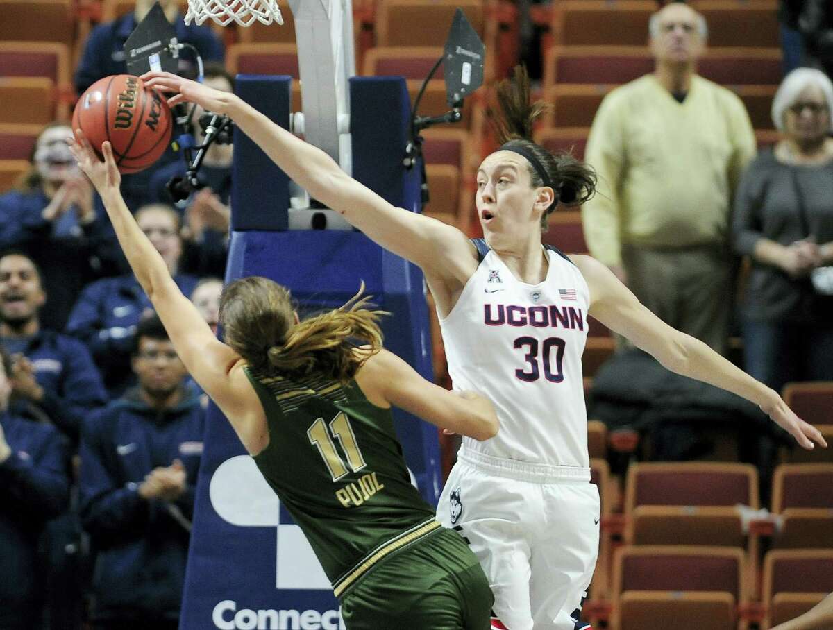 Connecticut’s Breanna Stewart blocks a shot attempt by South Florida’s Ariadna Pujol, left, during the first half of an NCAA college basketball game in the American Athletic Conference tournament finals at Mohegan Sun Arena, Monday, March 7, 2016, in Uncasville, Conn. (AP Photo/Jessica Hill)