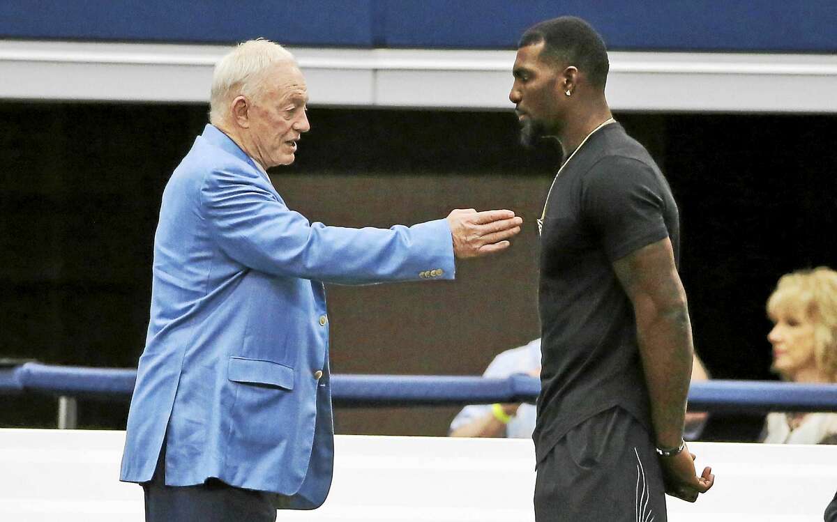 Dallas Cowboys wide receiver Dez Bryant, right, and team owner Jerry Jones talk on the sidelines during a minicamp at the team’s stadium in June.