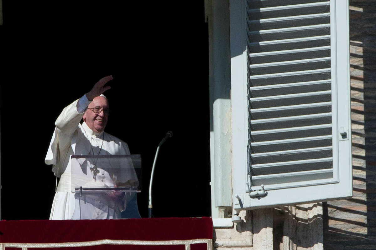 Pope Francis delivers his blessing during his Angelus prayer from his studio window overlooking St. Peter’s Square, at the Vatican on Nov. 8, 2015. In his first public comments on the latest scandal rocking the Vatican, Pope Francis told followers on Sunday that the theft of Vatican documents describing financial malfeasance inside the Holy See was a “crime” but pledged to continue reforms.