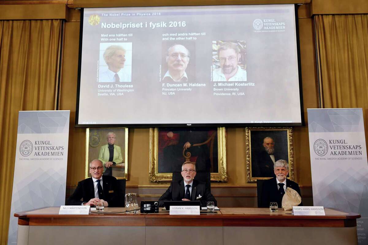 The Royal Academy of Sciences members, from left, Professor Nils Martensson, Professor Goran K Hansson and Professor Thomas Hans Hansson reveal the winners of the Nobel Prize in physics, at the Royal Swedish Academy of Sciences, in Stockholm, Sweden, Tuesday, Oct. 4, 2016. David Thouless, Duncan Haldane and Michael Kosterlitz have won the Nobel physics prize. Nobel jury praises physics winners for ‘discoveries of topological phase transitions and topological phases of matter’.