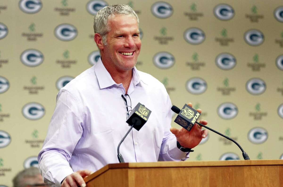 Former Green Bay Packers NFL football quarterback Brett Favre smiles at a news conference prior to being inducted into the Packers Hall of Fame and having his No. 4 jersey retired on July 18, 2015, at Lambeau Field in Green Bay, Wis.