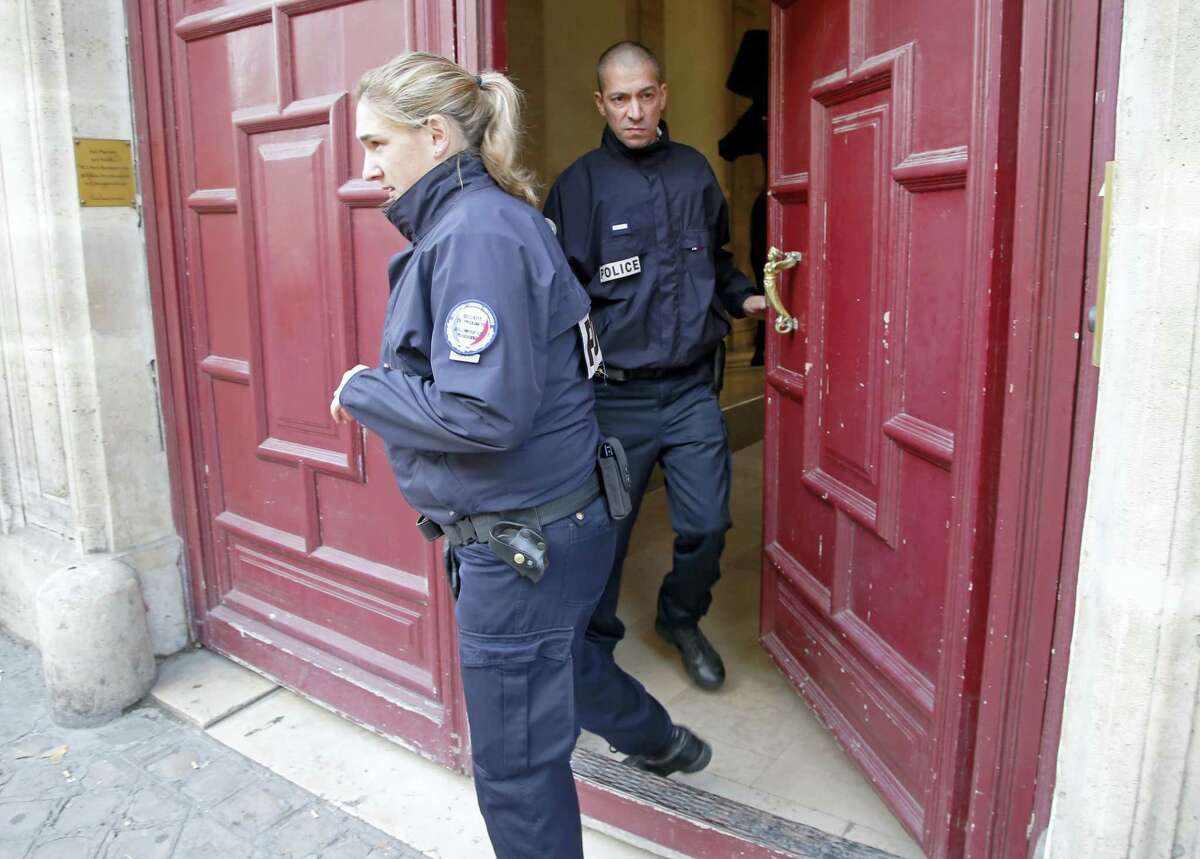 French police officers exit the residence of Kim Kardashian West in Paris Monday, Oct. 3, 2016. Kim Kardashian West was unharmed after being robbed at gunpoint of more than $10 million worth of jewelry inside a private Paris residence Sunday night, police officials said.