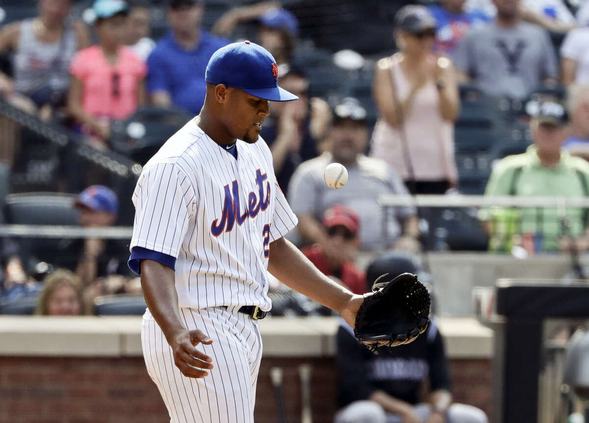 New York Mets relief pitcher Jeurys Familia reacts after a run scored on a wild pitch during the ninth inning against the Colorado Rockies Thursday. The Rockies beat the Mets 2-1.
