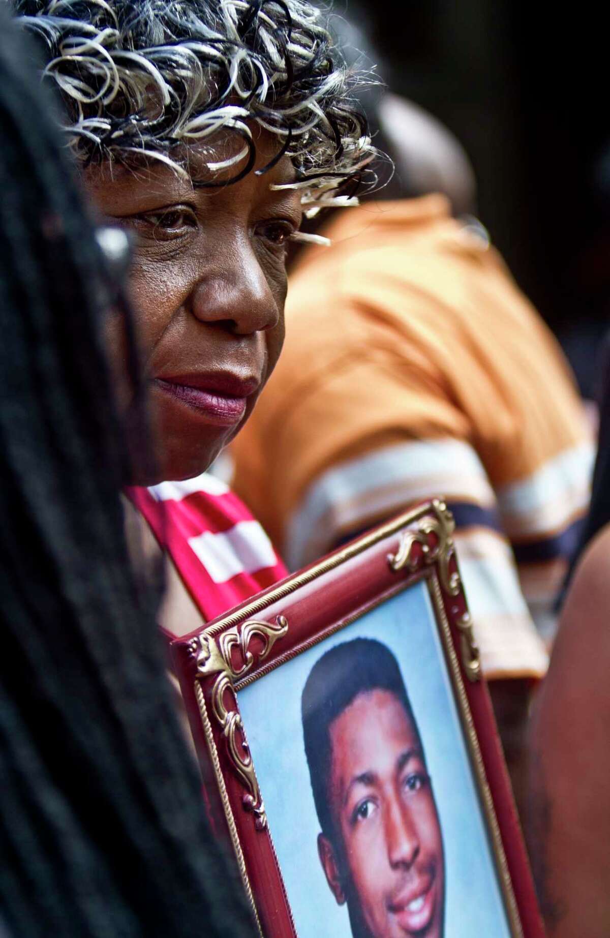 Gwen Carr holds a picture of her son Eric Garner during a news conference July 7 in New York with relatives of New Yorkers killed by police.