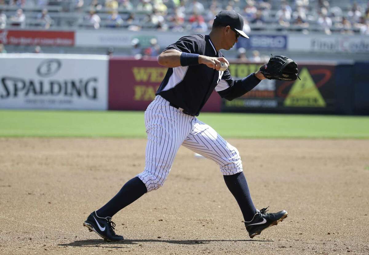 Yankees third baseman Alex Rodriguez throws to pitcher Adam Warren in the second inning Sunday.